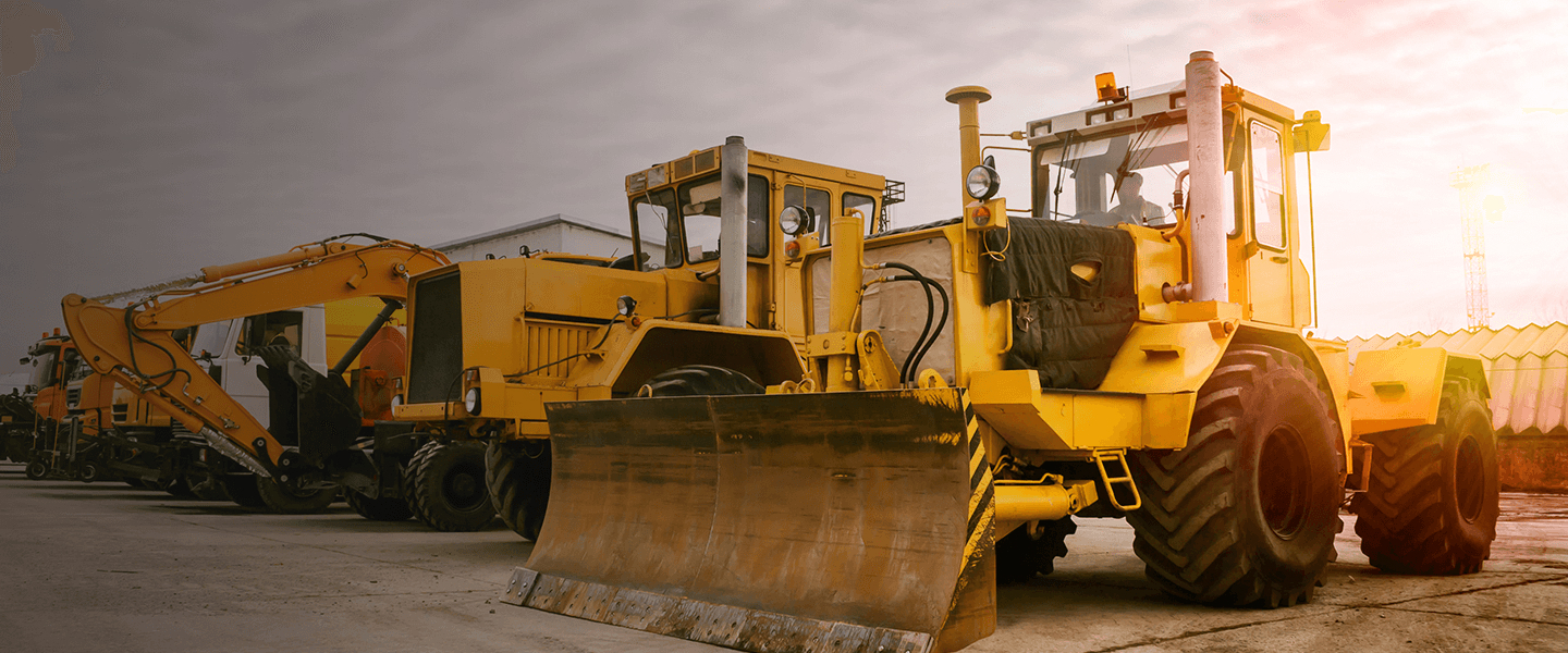 Row of heavy duty construction vehicles.